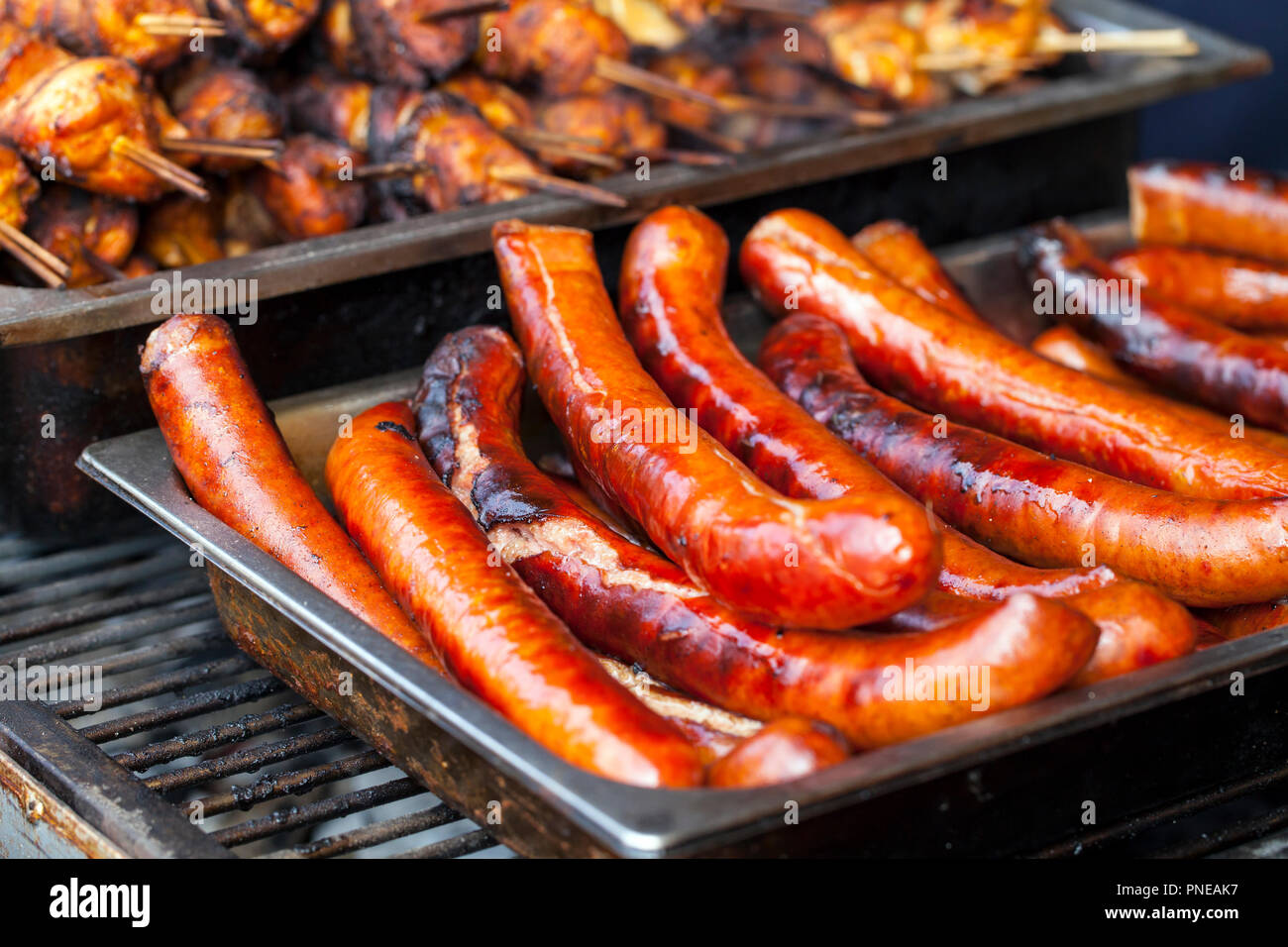 Grilled sausages and chicken skewers Stock Photo
