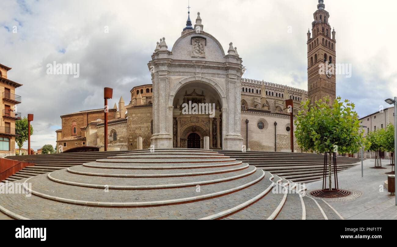 The Nuestra Señora de la Huerta gothic mudejar cathedral facade and bell tower, shot from entrance staircase, in a cloudy, autumn day, Tarazona, Spain Stock Photo