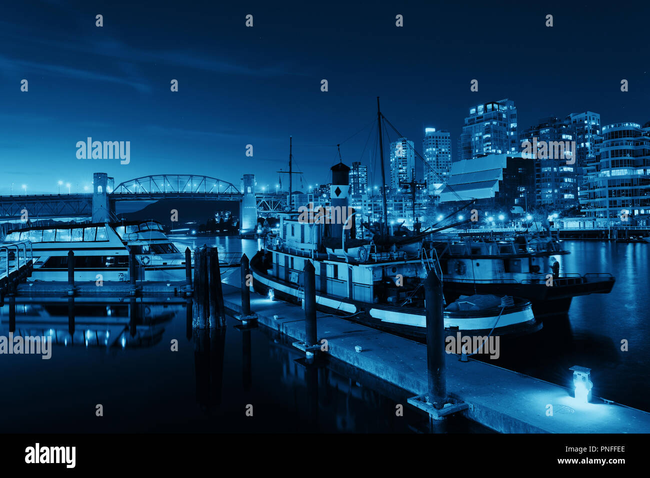 Vancouver False Creek at night with bridge and boat Stock Photo - Alamy