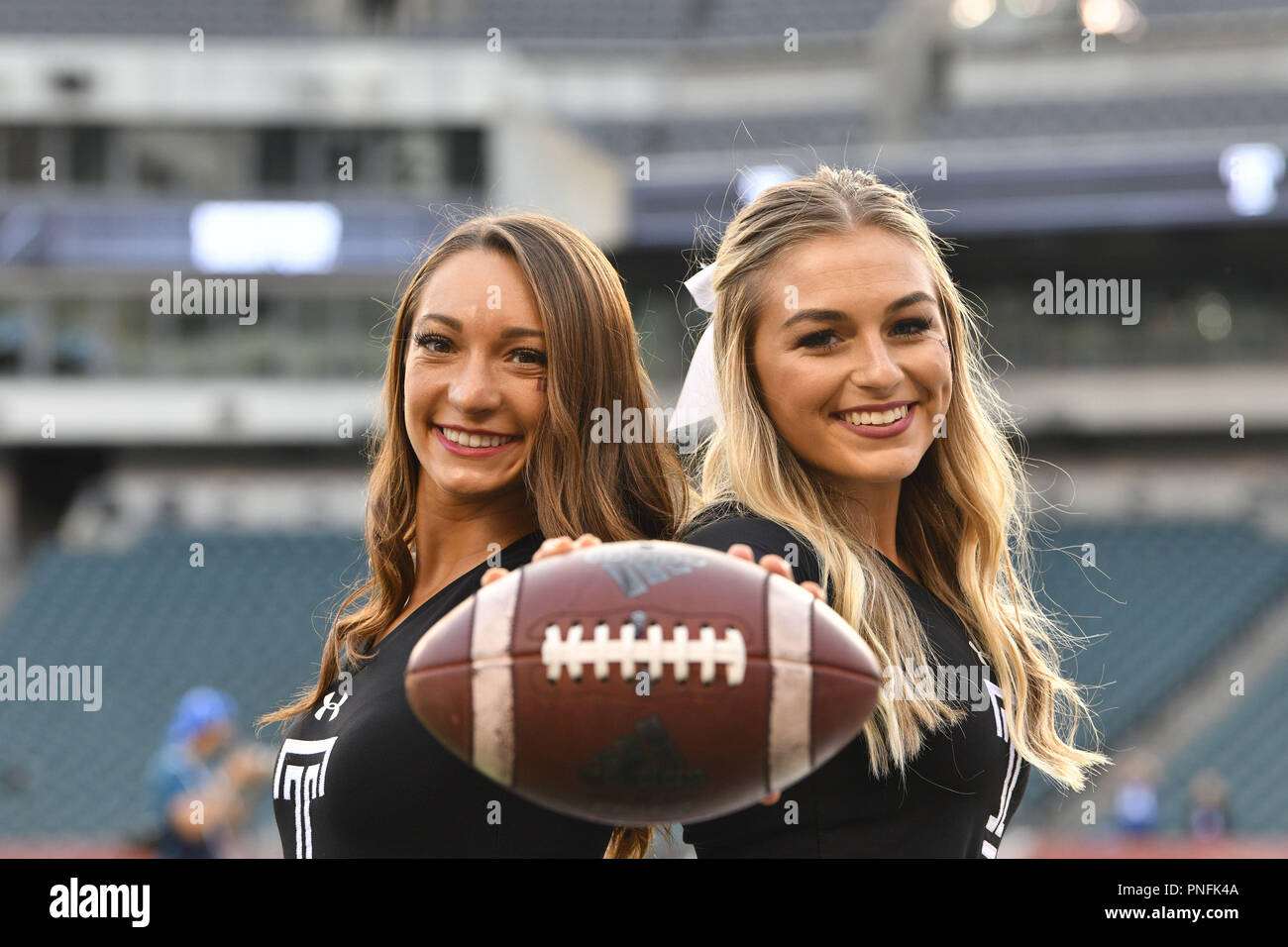 Philadelphia, Pennsylvania, USA. 20th Sep, 2018. Two Temple Owls cheerleaders pause for a photo prior the American Athletic Conference football game played at Lincoln Financial Field in Philadelphia. Temple beat Tulsa 31-17. Credit: Ken Inness/ZUMA Wire/Alamy Live News Stock Photo