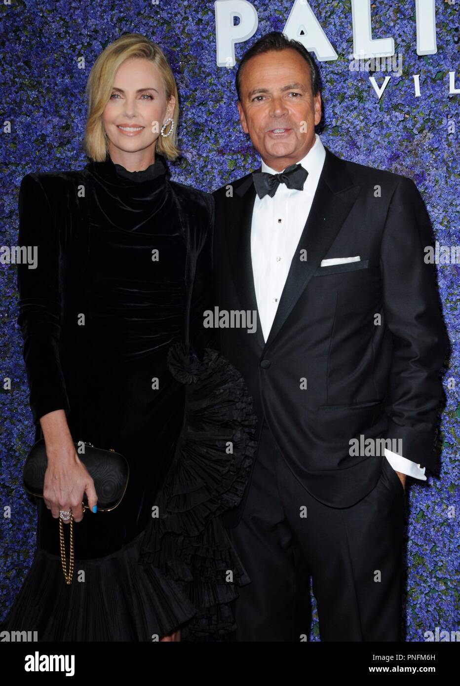 Pacific Palisades, CA. 20th Sep, 2018. Rick Caruso, Charlize Theron at