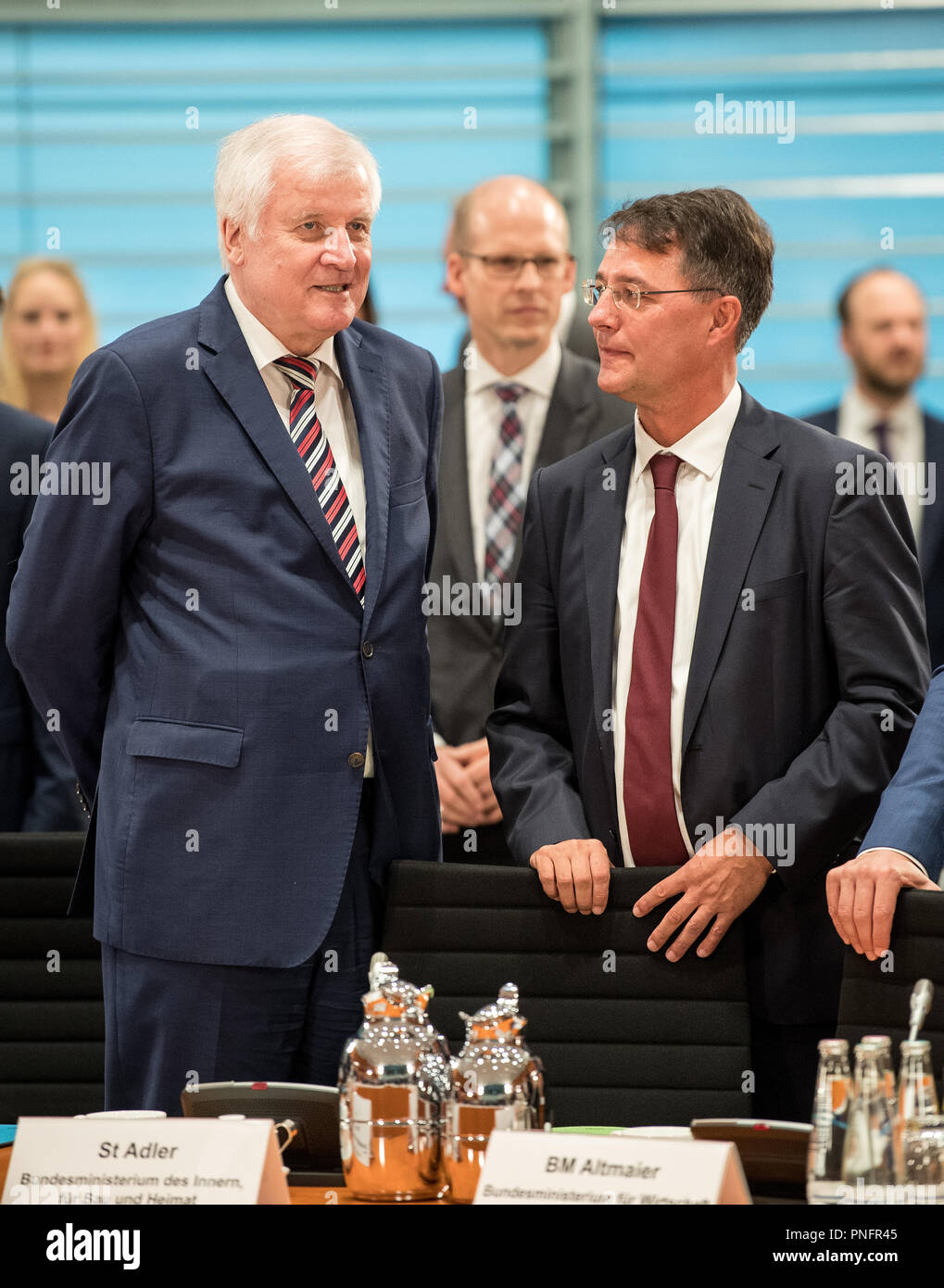 21 September 2018, Berlin: Horst Seehofer (L), Federal Minister of the Interior (CSU), stands next to Gunther Adler, State Secretary in the Ministry of the Interior (SPD), at the beginning of the residential summit in the Federal Chancellery. The agenda includes discussions with experts and politicians on the subject of affordable housing, reducing construction costs and securing skilled labour. Photo: Fabian Sommer/dpa Stock Photo