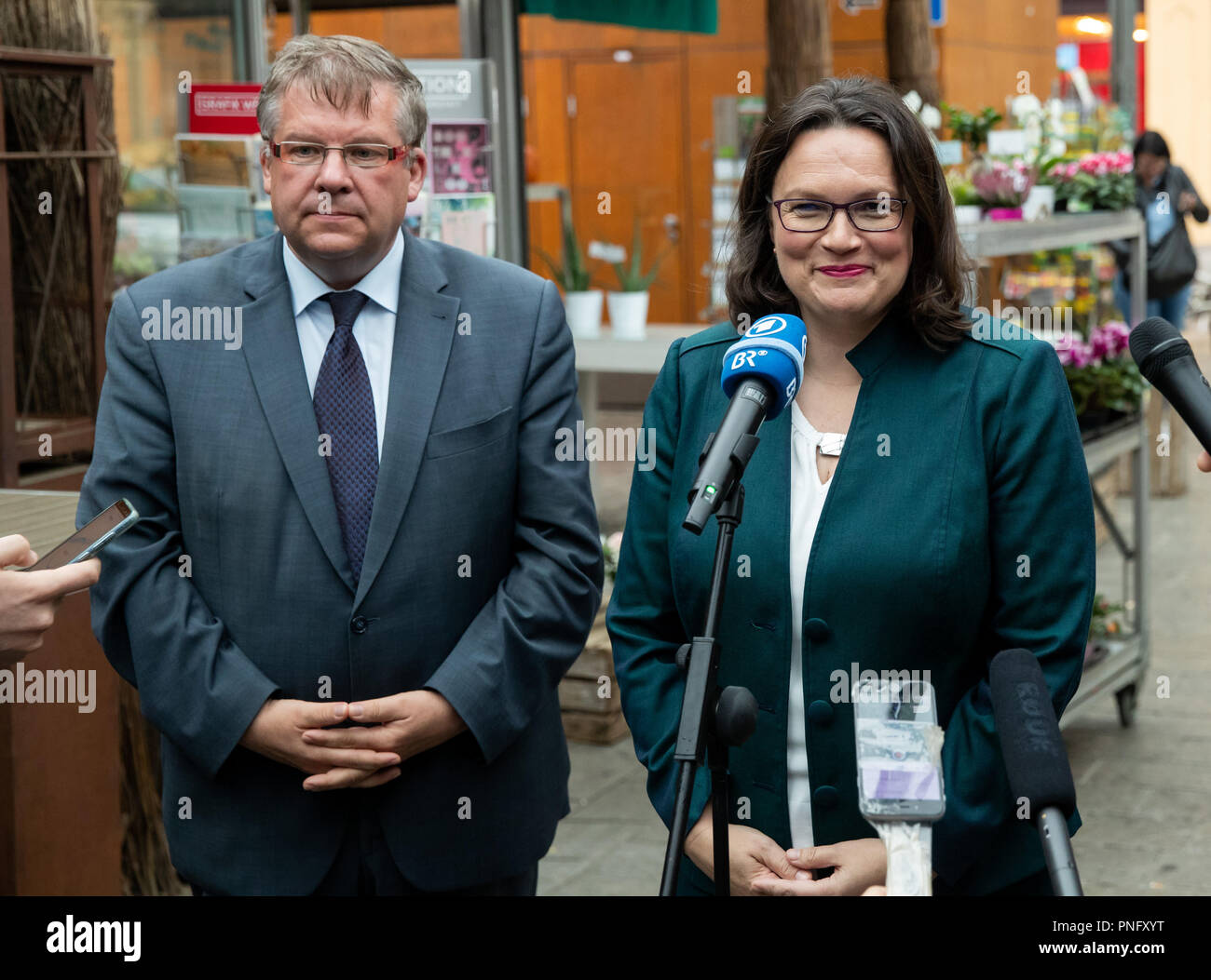 Wuerzburg, Bavaria. 21st Sep, 2018. Andrea Nahles, chairman of the SPD, commenting on the case of the former President of the Office for the Protection of the Constitution Maassen together with Volkmar Halbleib, the chairman of the SPD subdistrict of Wuerzburg-Land. Nahles has admitted misjudgment in the case of the previous President of the Office for the Protection of the Constitution. She herself, Chancellor Merkel and CSU leader Seehofer, 'we were all three wrong,' said Nahles. Credit: Daniel Karmann/dpa/Alamy Live News Stock Photo