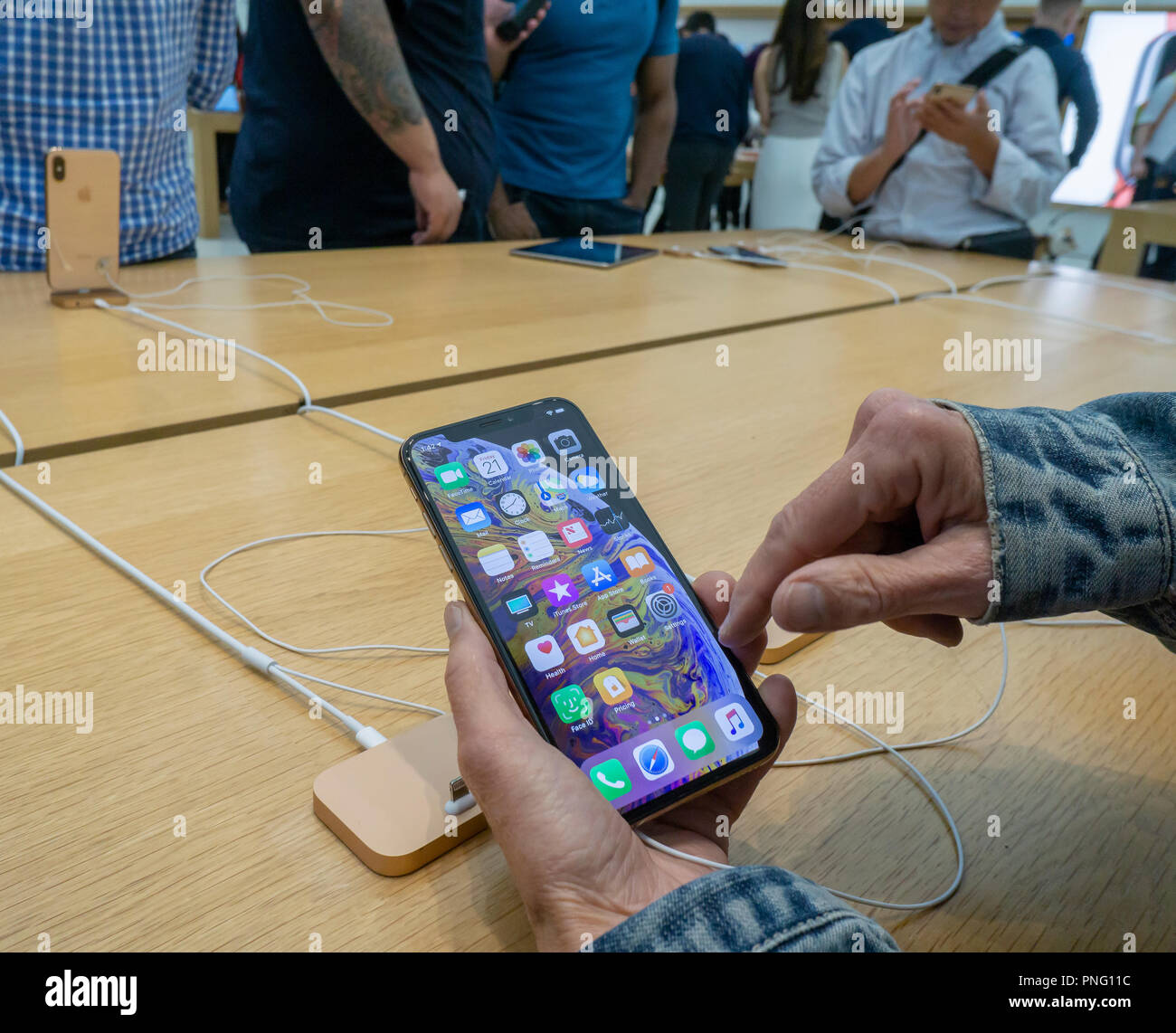 New York, USA. 21st September 2018. Customers in the Apple store in the WTC Transportation Hub in New York try out the new iPhone XS on Friday, September 21, 2018, the first day they went on sale.  The new phones, anxiously awaited by drooling iPhone aficionados, sell for a whopping $999 for the XS and $1099 for the XS Max with the Max having a 6.5 inch display.  (Â© Richard B. Levine) Credit: Richard Levine/Alamy Live News Credit: Richard Levine/Alamy Live News Stock Photo