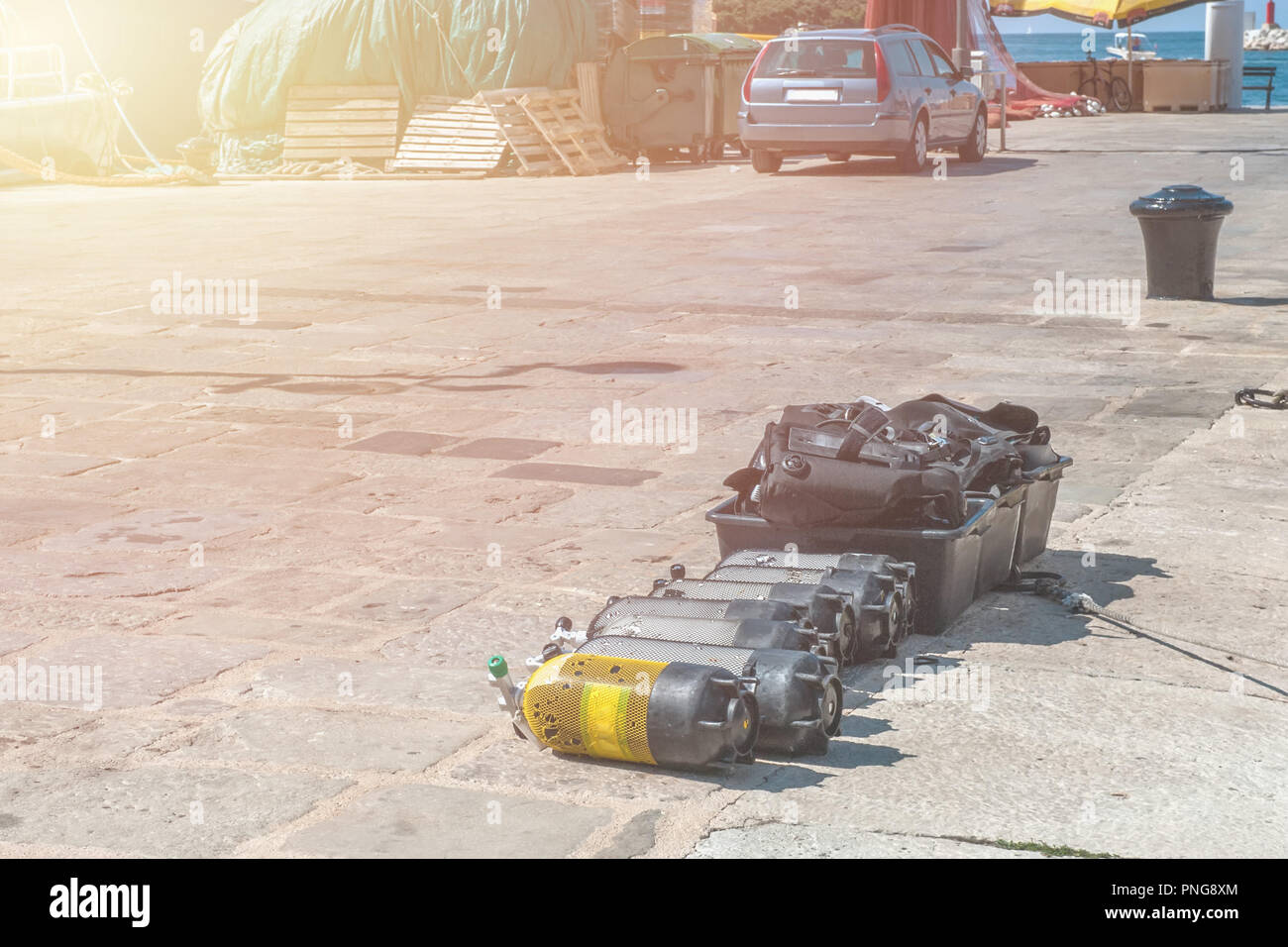 air cylinders for scuba diving on the pier. Full oxygen tanks and diving equipment ready to dive Stock Photo