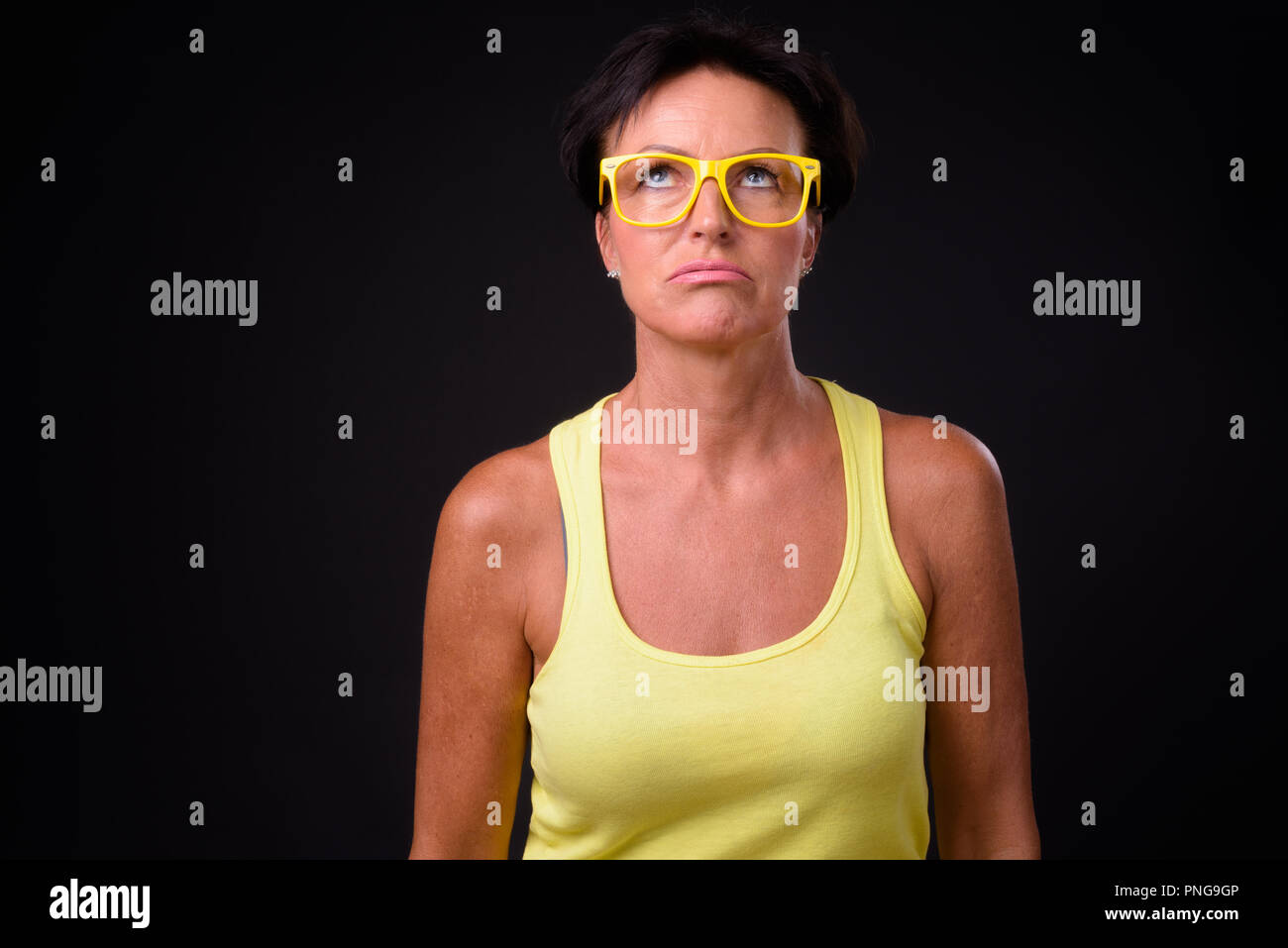 Mature Beautiful Woman With Short Hair Against Black Background