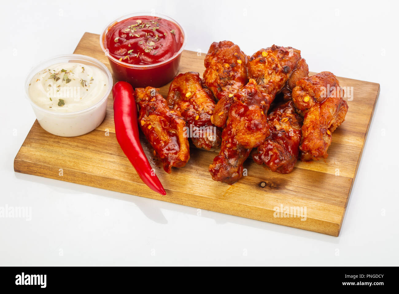 Buffalo chicken wings with sauce and pepper Stock Photo - Alamy