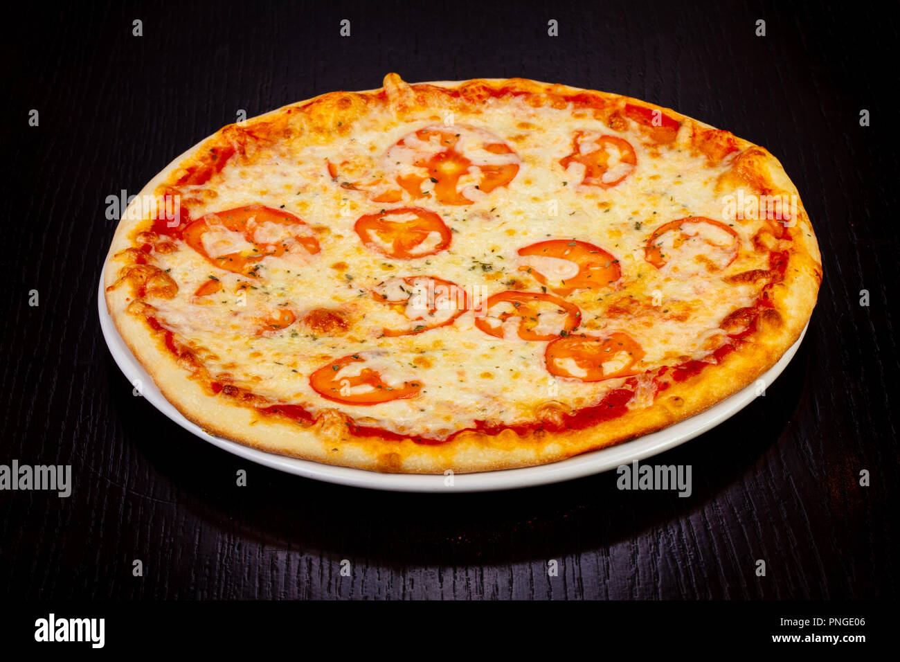 Delicious margarita pizza with tomatoes Stock Photo Alamy