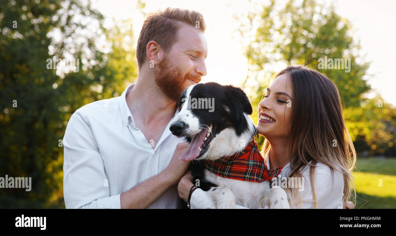 Romantic couple in love walking dogs and bonding Stock Photo - Alamy