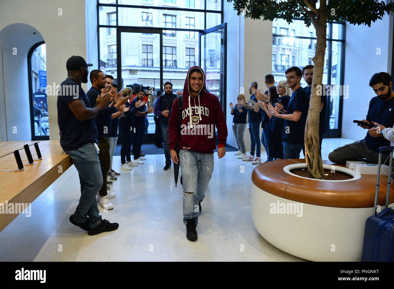 The First Customers Enter The Apple Store In Regent Street