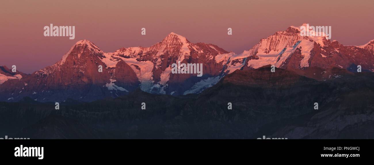 Mountains Eiger, Monch and Jungfrau at sunset. View from Mount Niesen. Switzerland. Stock Photo
