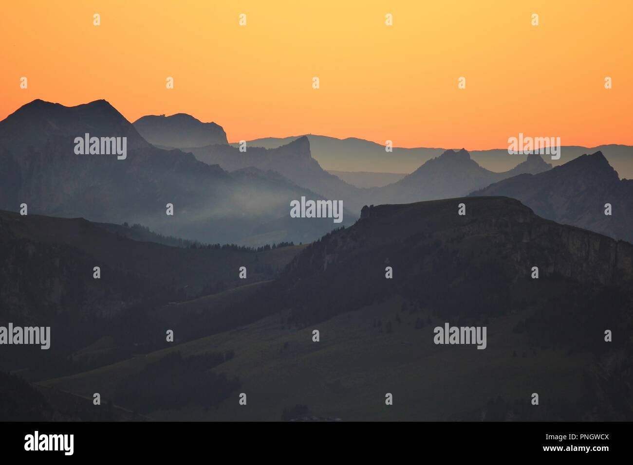 Mountains in the Bernese Oberland at sunset. View from Mount Niesen, Switzerland. Stock Photo
