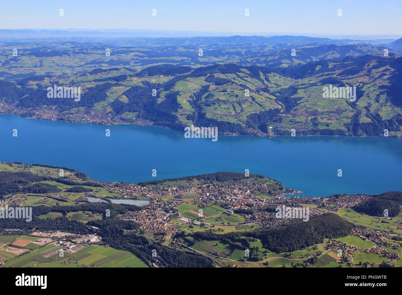 Village Spiez and Lake Thun seen from Mount Niesen. Landscape in the Bernese Oberland. Stock Photo