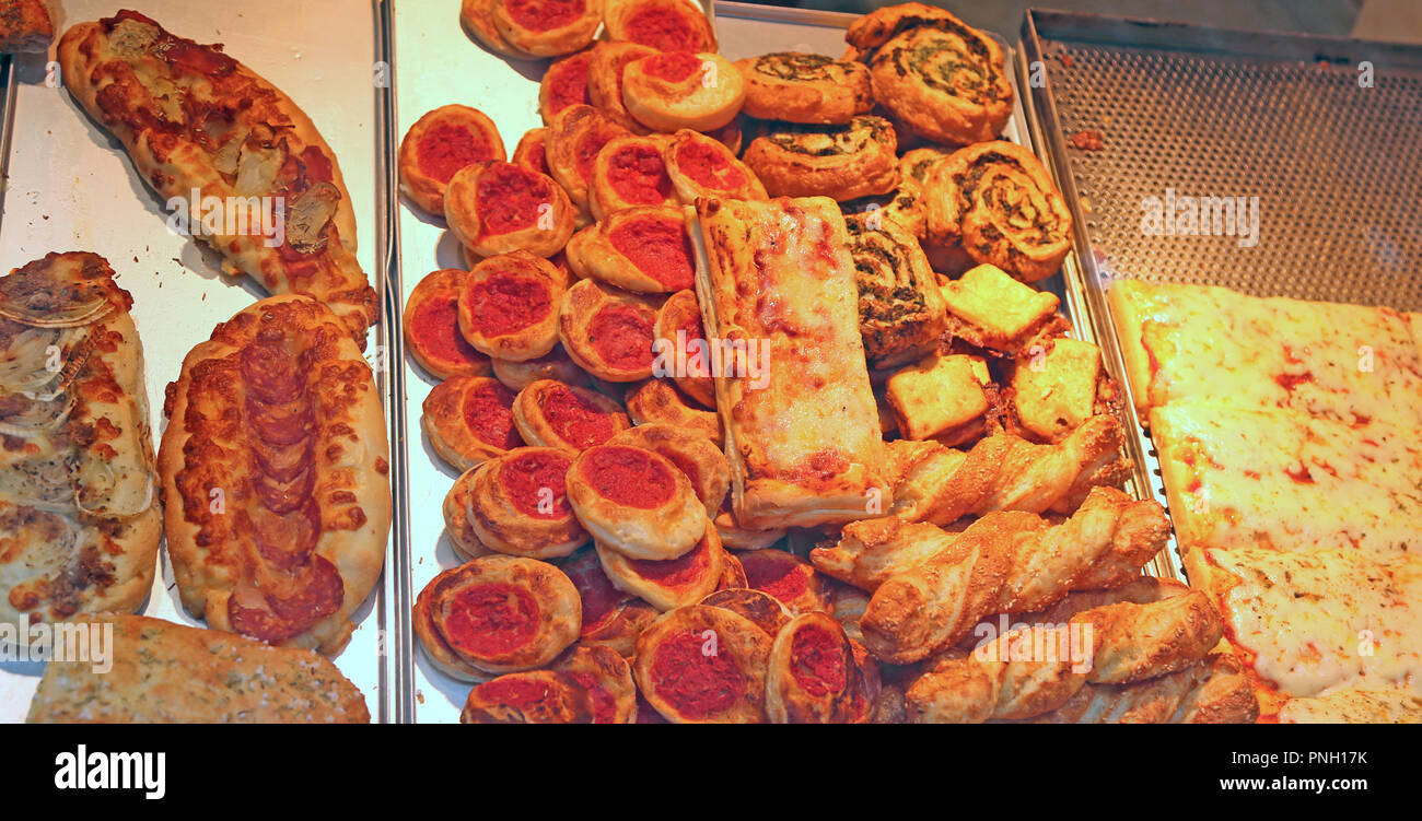 italian snack with red tomato sauce and pizza for sale at bar Stock Photo