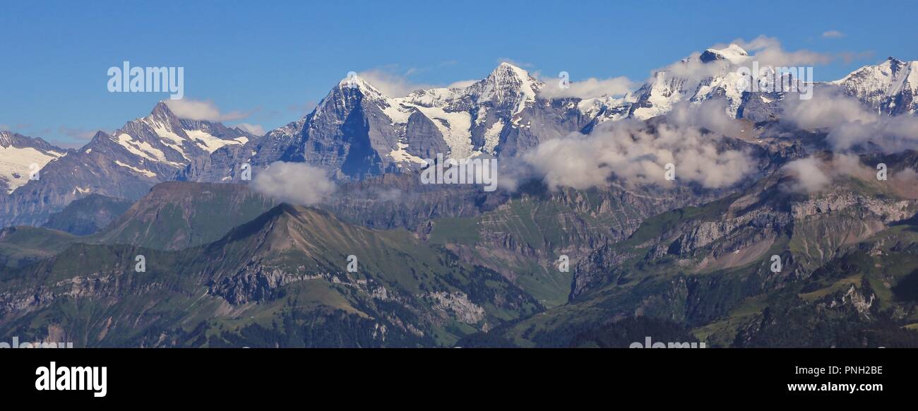 Famous mountains Eiger, Monch and Jungfrau seen from Mount Niesen, Switzerland. Stock Photo
