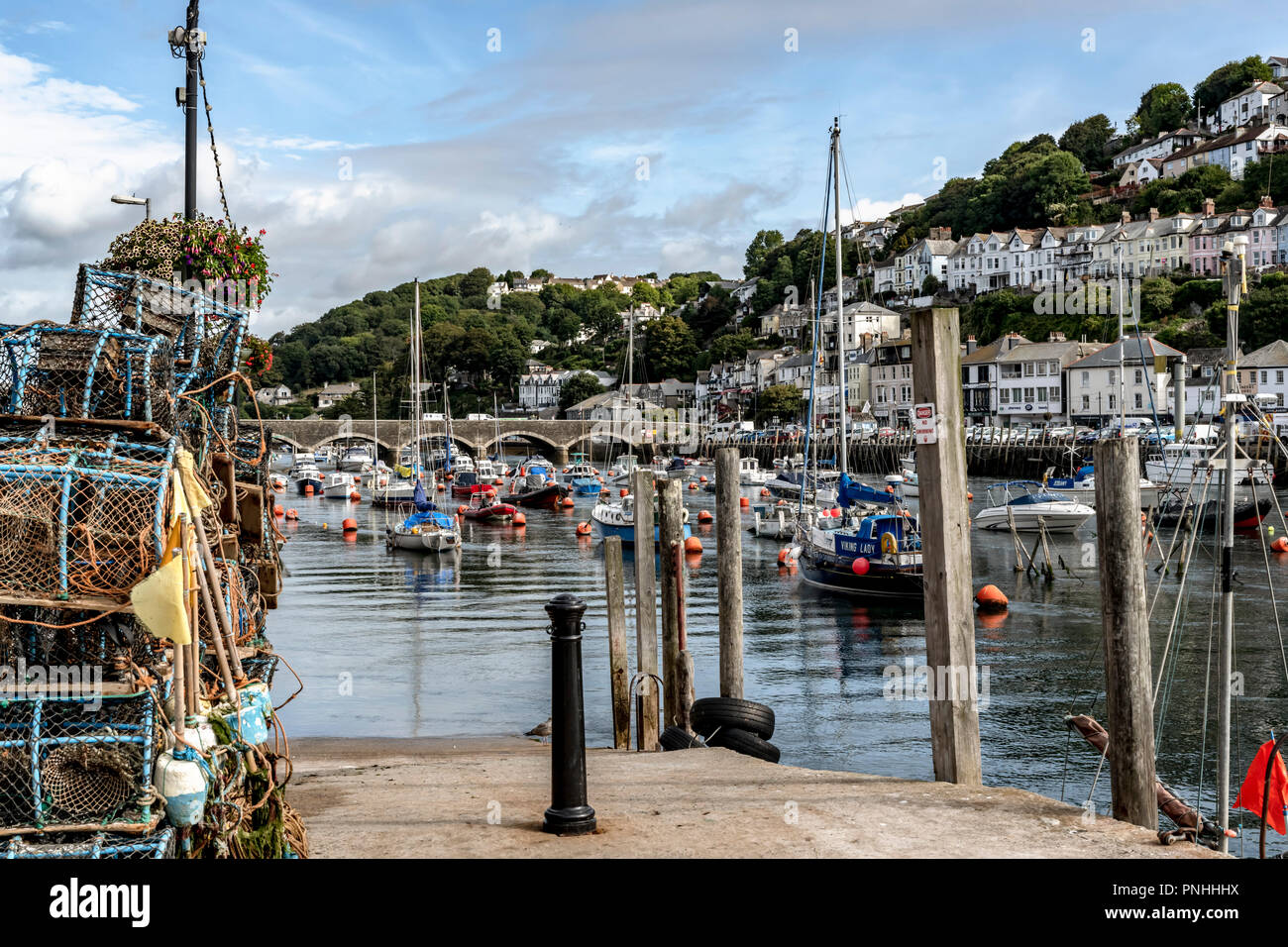 LOOE, Cornwall, England, UK - September 10 2018: The town of Looe Estuary in high tide with fishing boats and Yachts. Looe a very popular fishing port Stock Photo