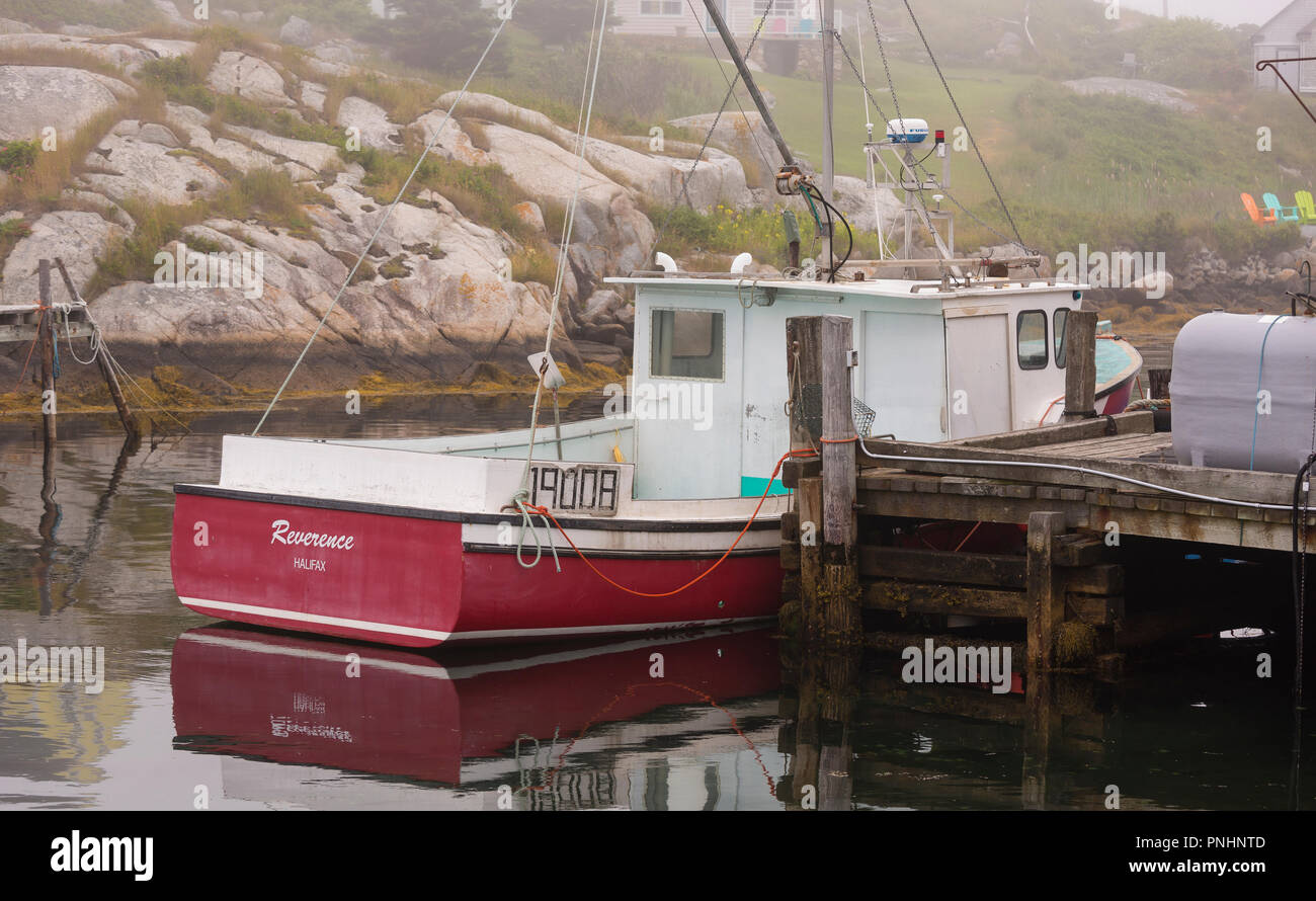 PEGGY'S COVE, NOVA SCOTIA, CANADA - Boat docked in fishing harbor. Stock Photo