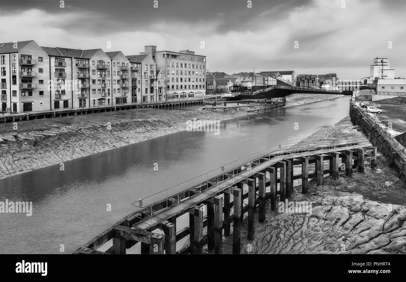 River Hull at low tide with view of Scale Lane swing bridge at low tide with view of wooden causeway, now obsolete, in Hull, Yorkshire, UK. Stock Photo