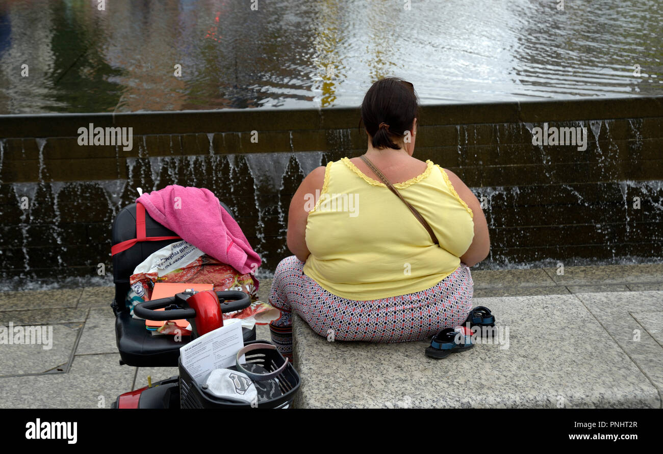 Obese woman, with mobility scooter Stock Photo Alamy