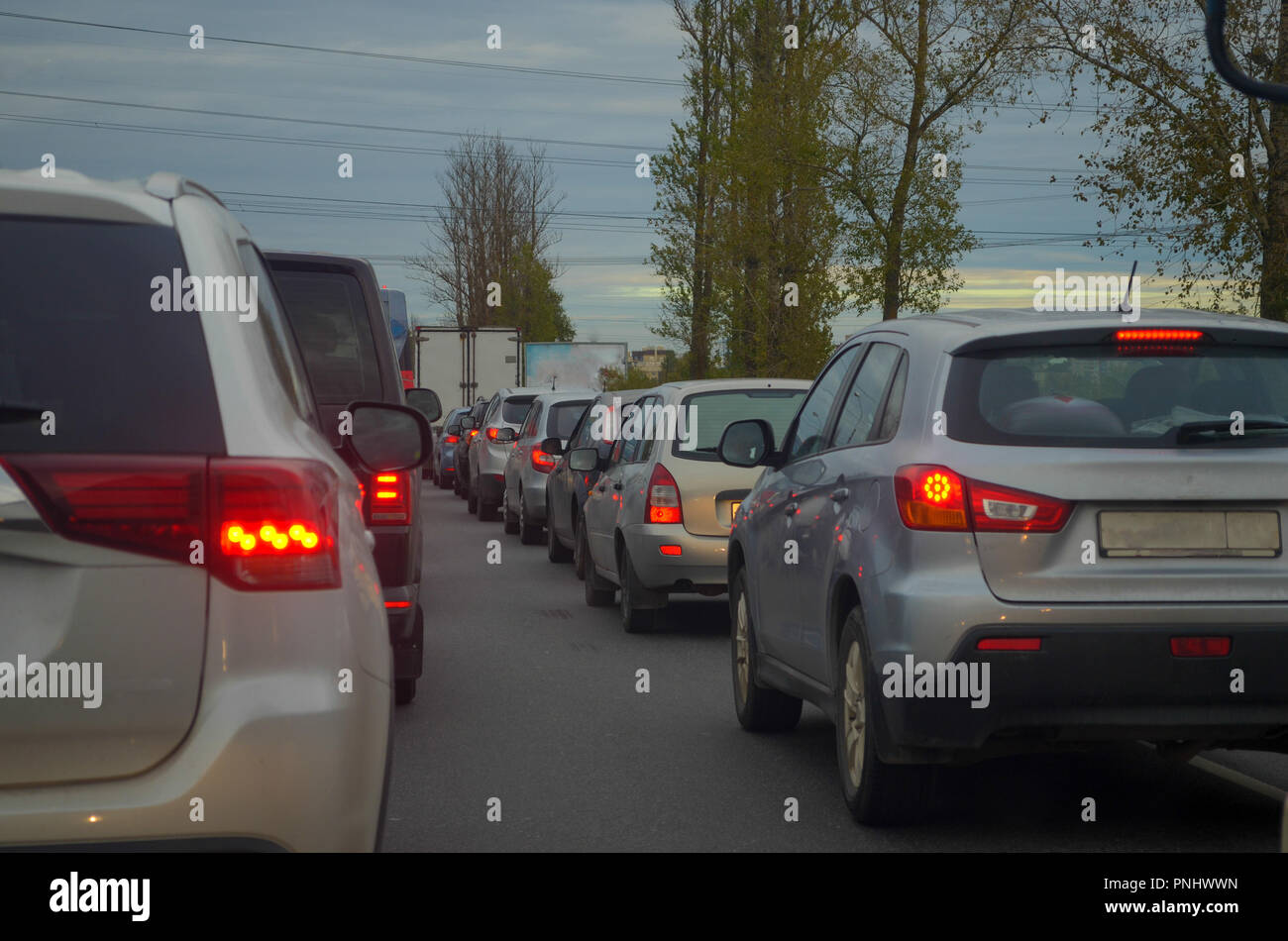 Traffic jam with row of cars on highway during rush hour. Stock Photo