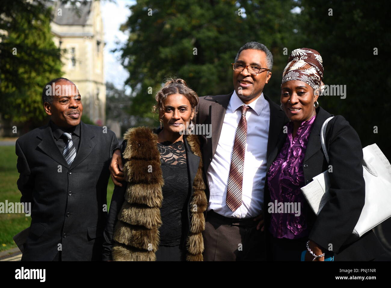 Former boxer Michael Watson (right) with family members outside Snaresbrook Crown Court in London where a group of men have been jailed for carrying out a violent carjacking on him. Stock Photo