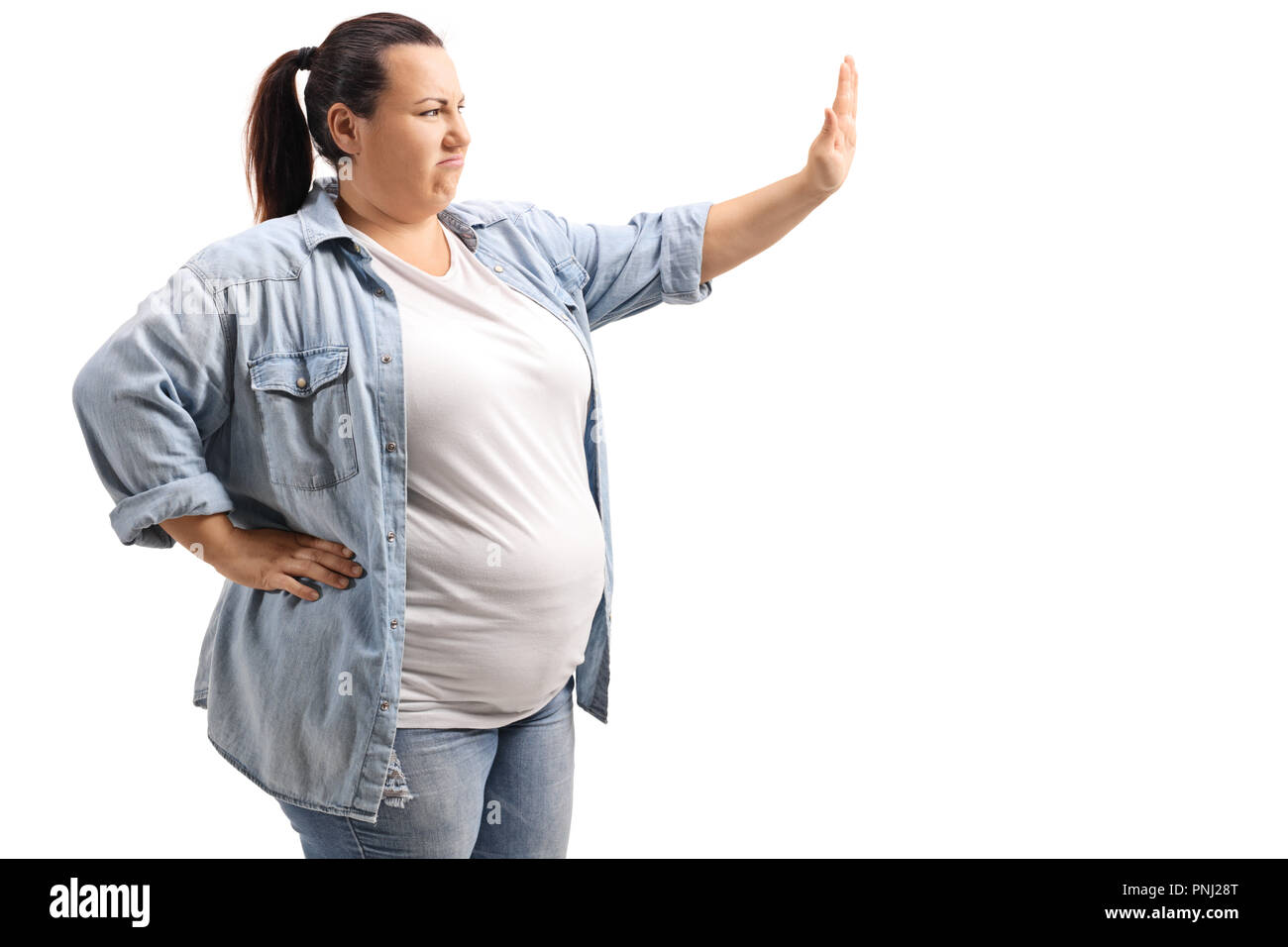 Overweight woman gesturing stop isolated on white background Stock Photo