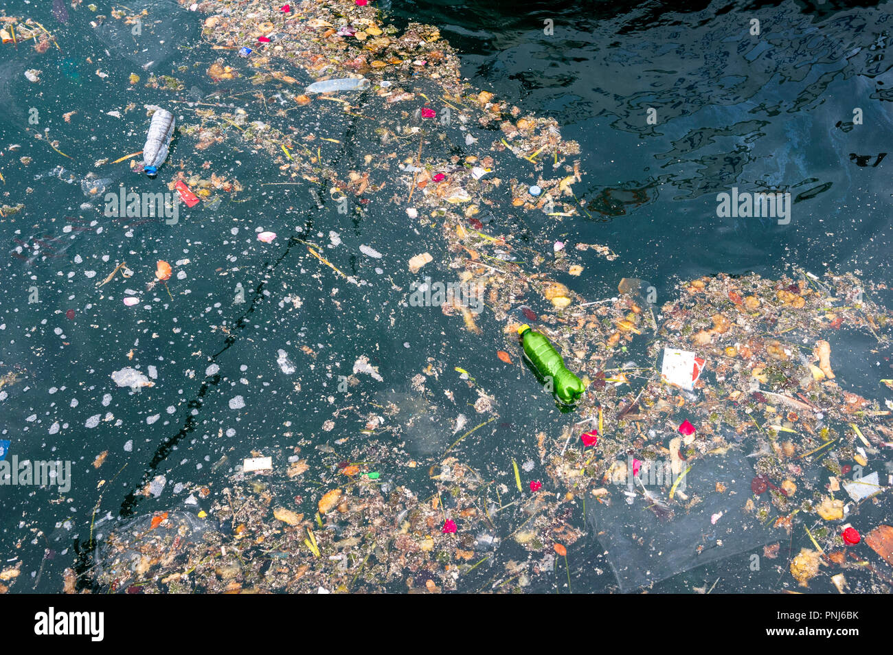 Plastic waste, bottles and other rubbish in the harbour at Valletta