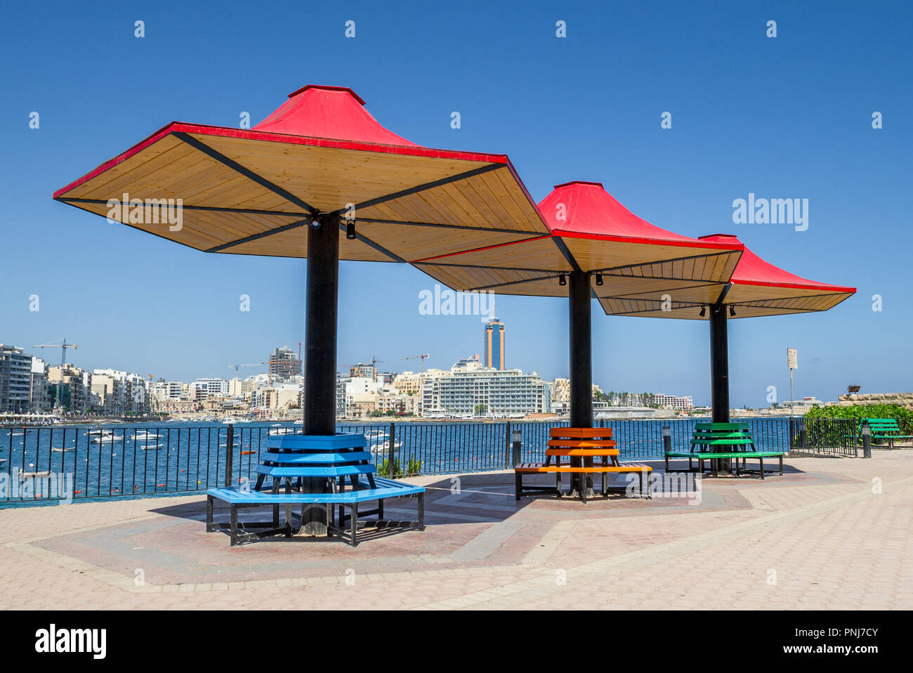 Large metal and wood seated sun canopies. Stock Photo