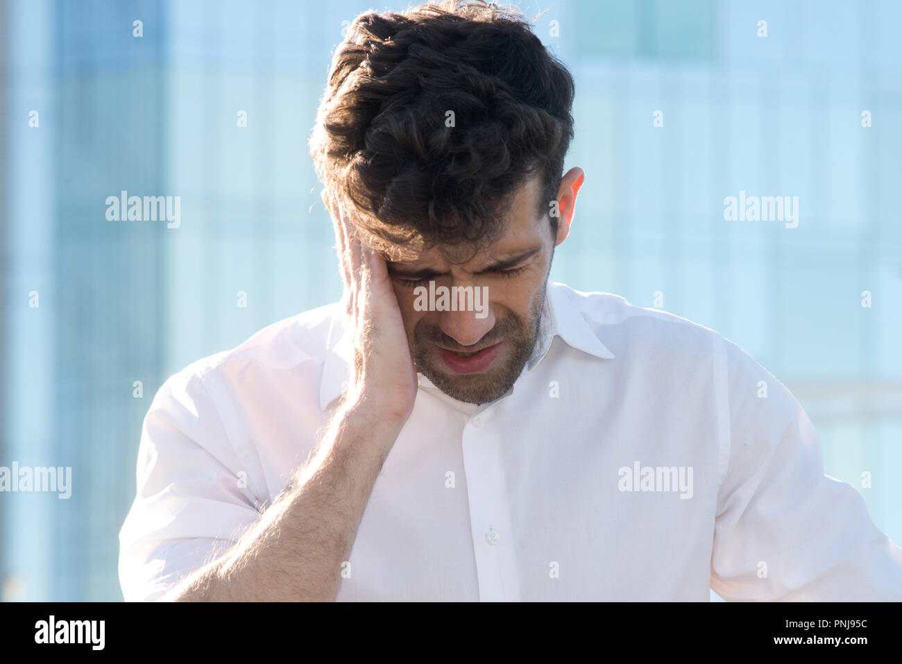 Man having a headache Stock Photo