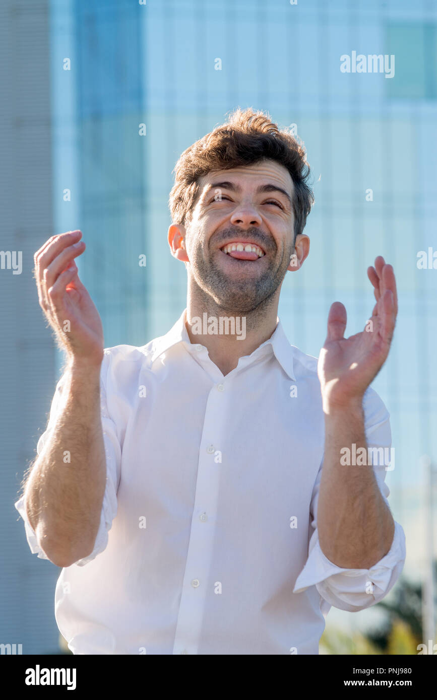 Young Man celebrate winning aplause Stock Photo