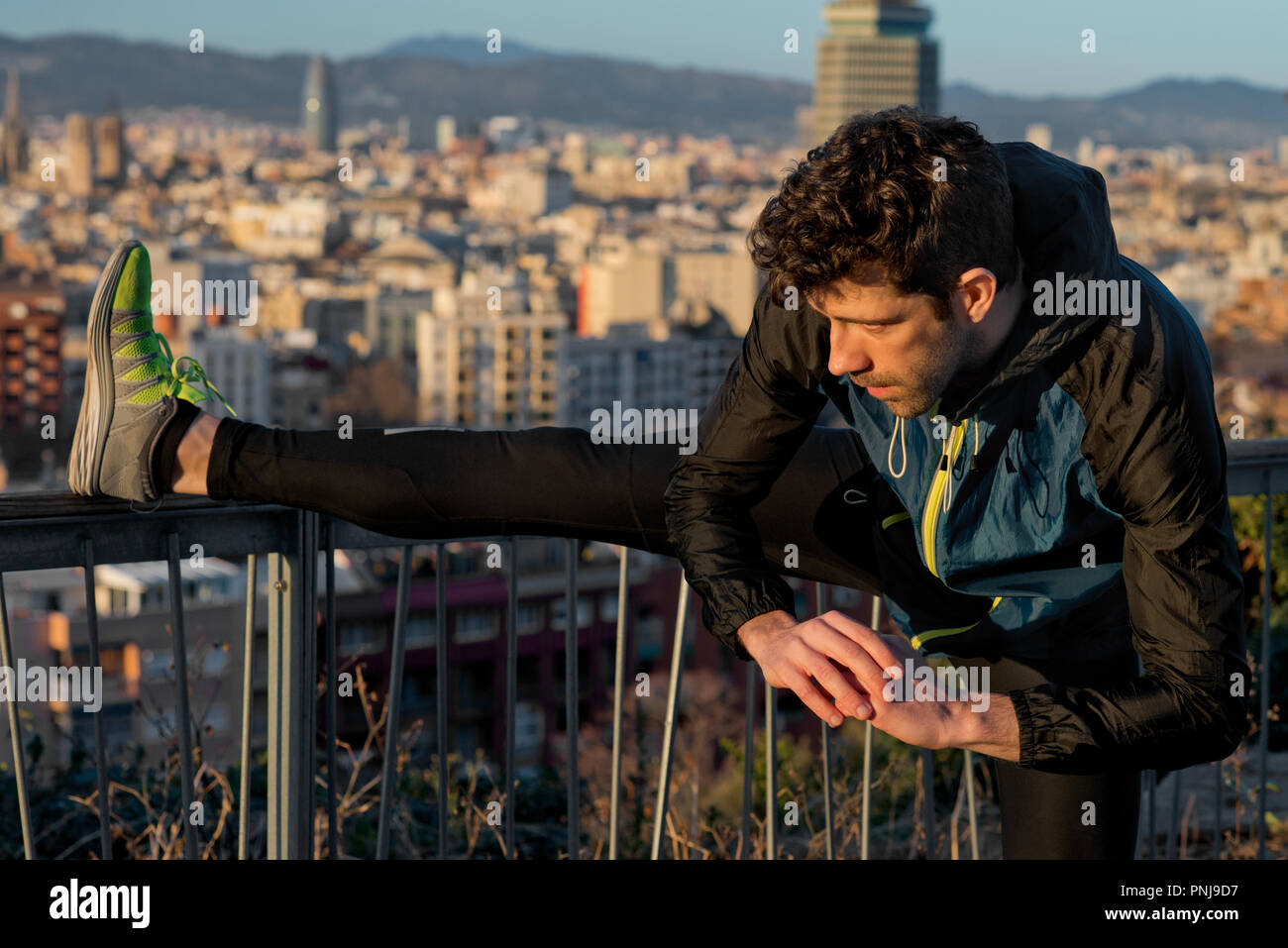 Young man stretching leg sunrise hi-res stock photography and images ...