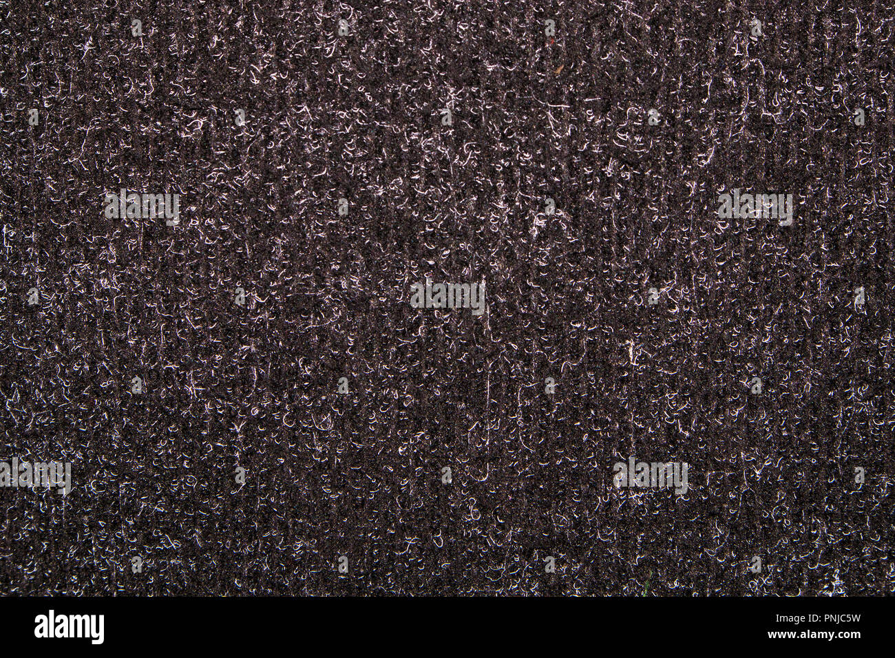 Brown synthetic short-napped floor carpet covering, may be used as background or texture Stock Photo