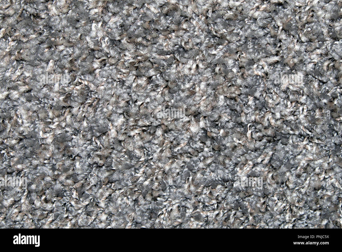Gray synthetic short-napped floor carpet covering, may be used as background or texture Stock Photo