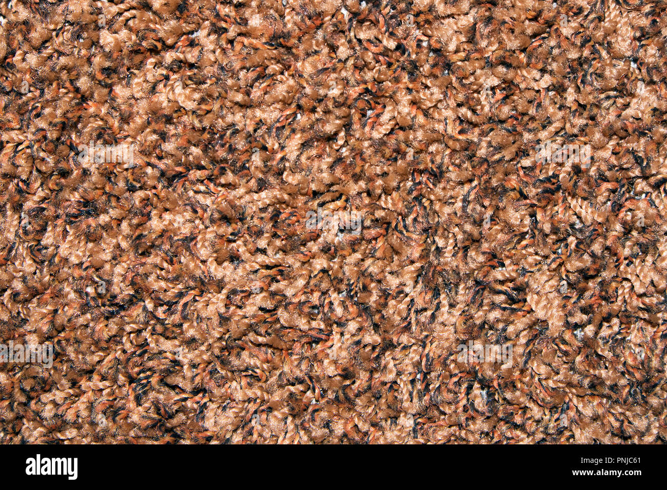 Brown synthetic short-napped floor carpet covering, may be used as background or texture Stock Photo