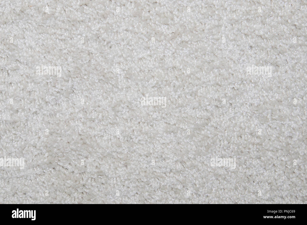 White synthetic short-napped floor carpet covering, may be used as background or texture Stock Photo