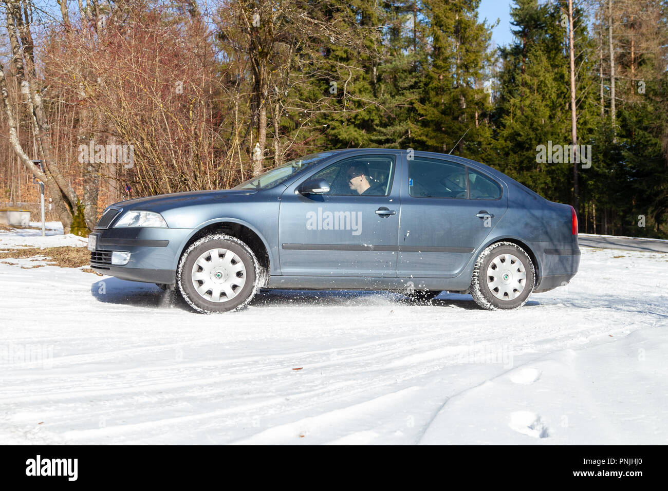 MUNICH / GERMANY - FEBRUARY 22, 2018: Skoda Octavia drives off road on a snow track. The Octavia is a small family car produced by the Czech manufactu Stock Photo