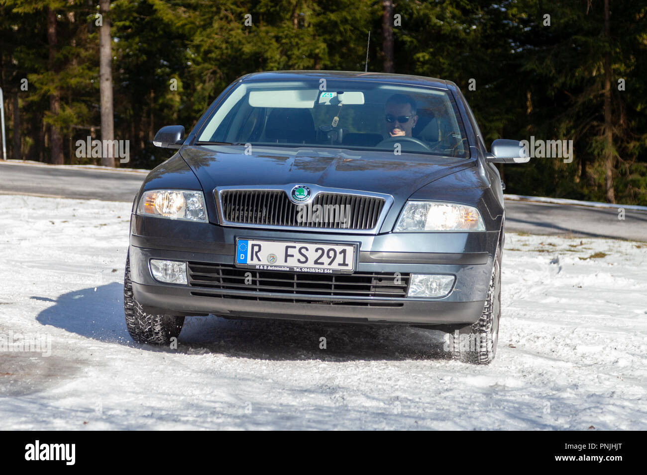 MUNICH / GERMANY - FEBRUARY 22, 2018: Skoda Octavia drives off road on a snow track. The Octavia is a small family car produced by the Czech manufactu Stock Photo
