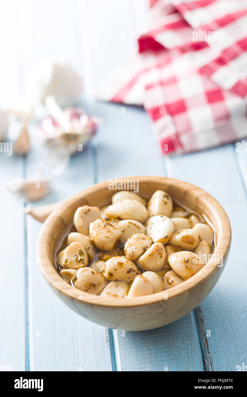 Marinated garlic. Pickled garlic in bowl. Stock Photo