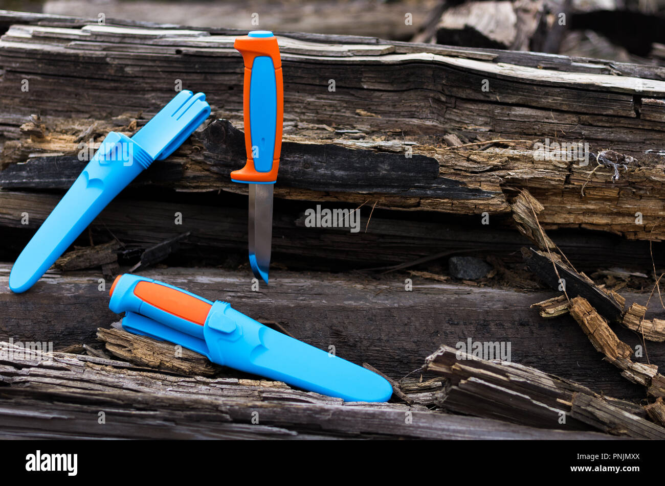 Two knives and a plastic sheath. Bright knives Stock Photo Alamy