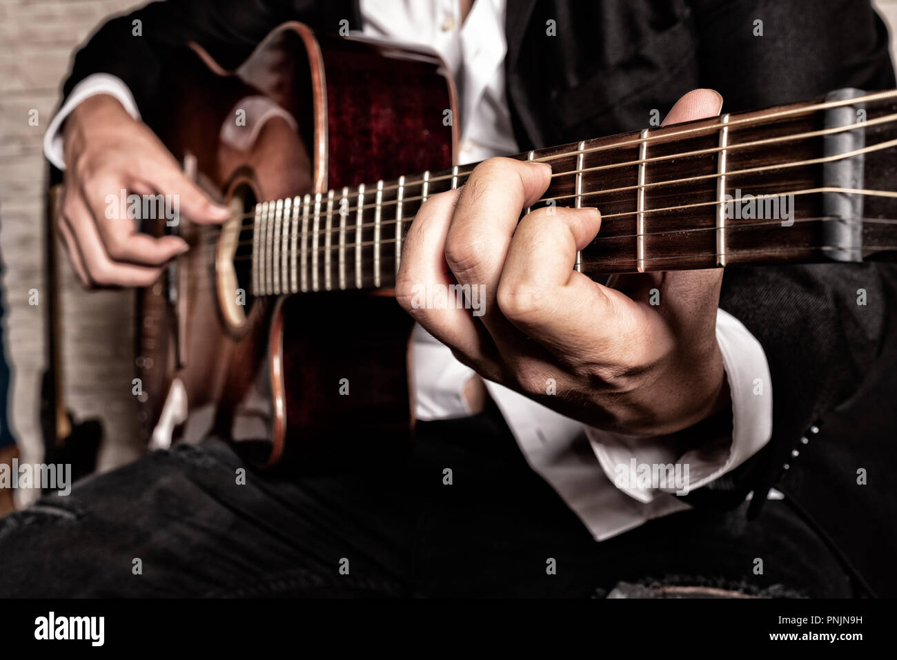 hands of musician playing the guitar Stock Photo