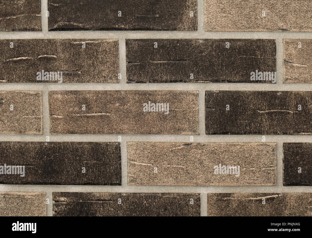 Grainy texture brown bricks wall pattern background Stock Photo