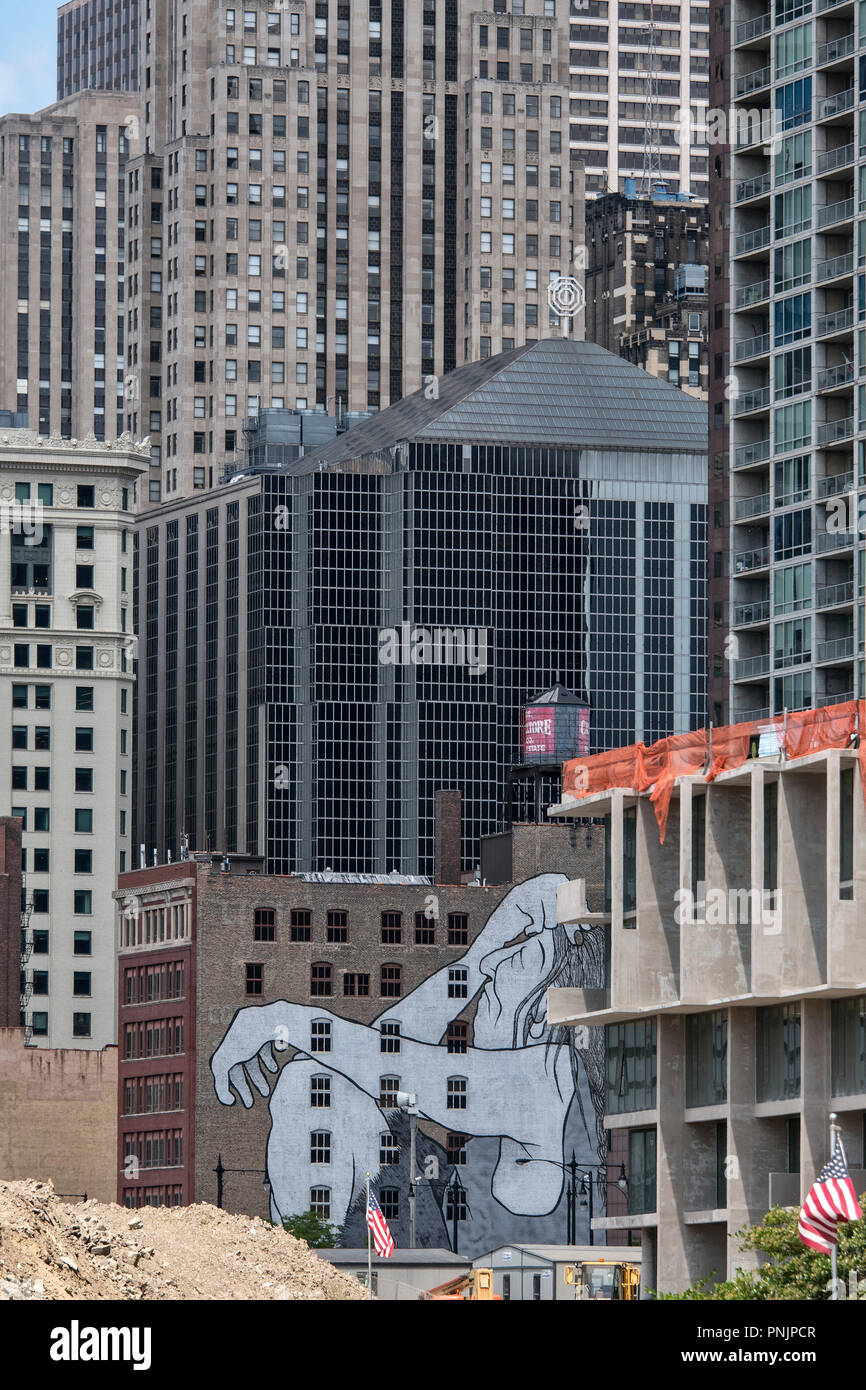 Detail of an old and new building with a large mural and American flag, Downtown Chicago, IL. Stock Photo