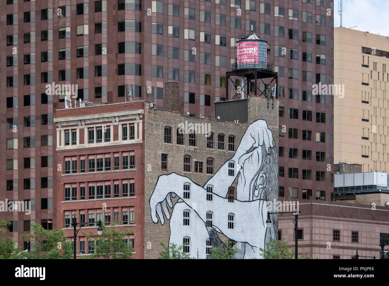 Detail of an old and new building with a large mural, Downtown Chicago, IL. Stock Photo