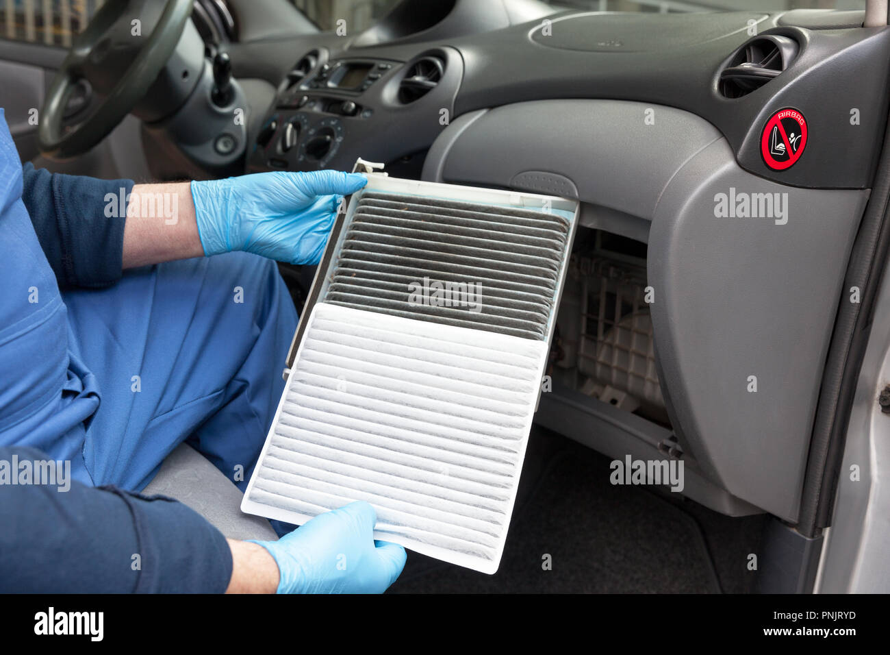 Replacing An Old Car Cabin Air Filter Auto Mechanic In Protective
