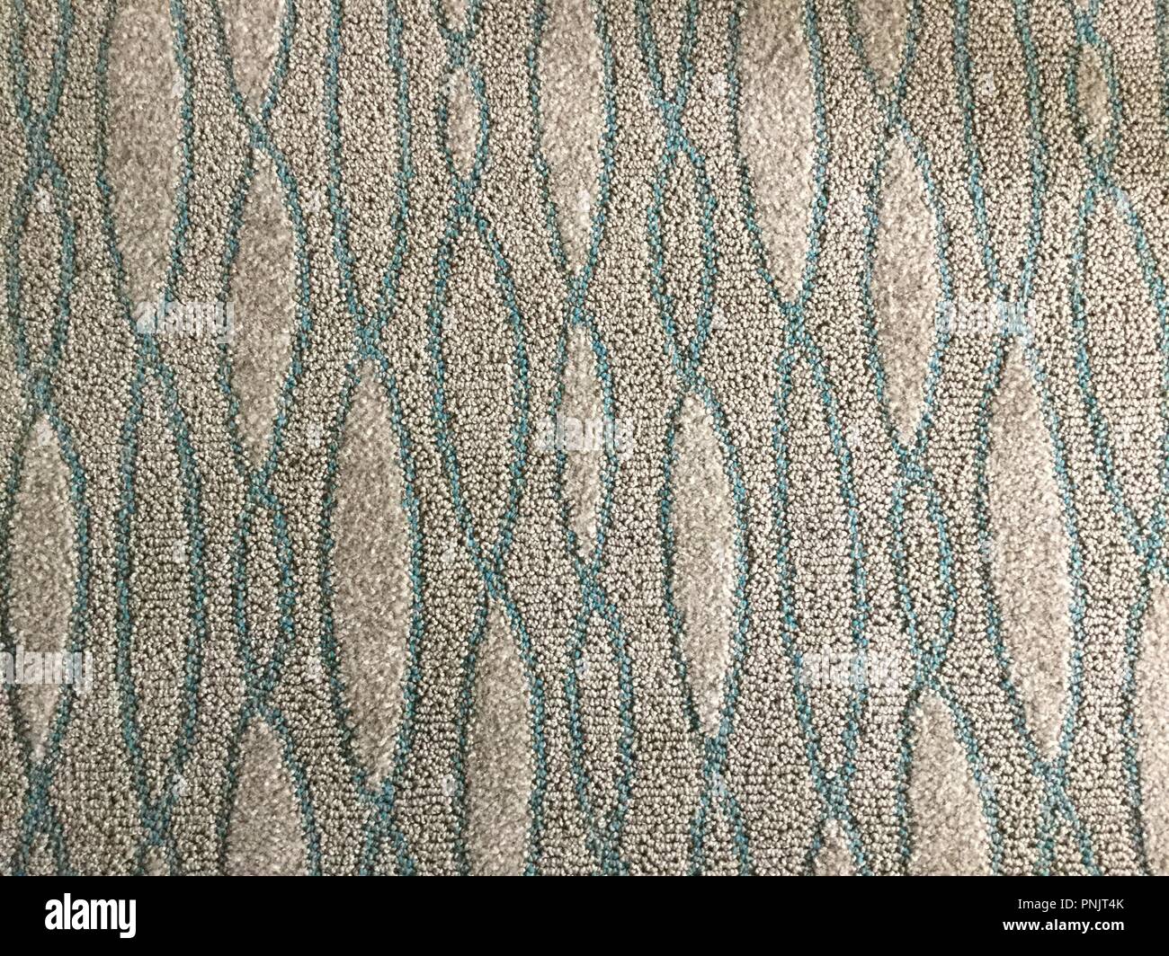 Abstract design on carpet, blue and white. Stock Photo