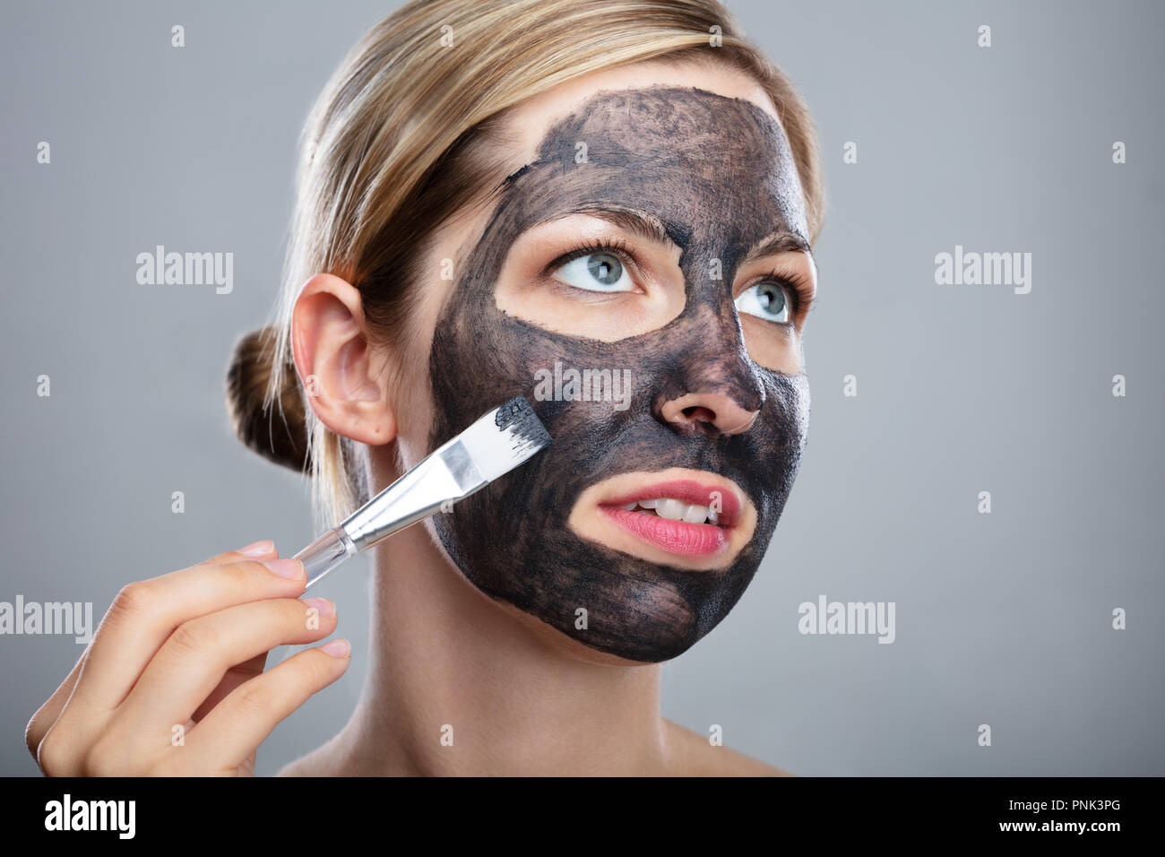 Black woman applying beauty mask hi-res stock photography and images ...