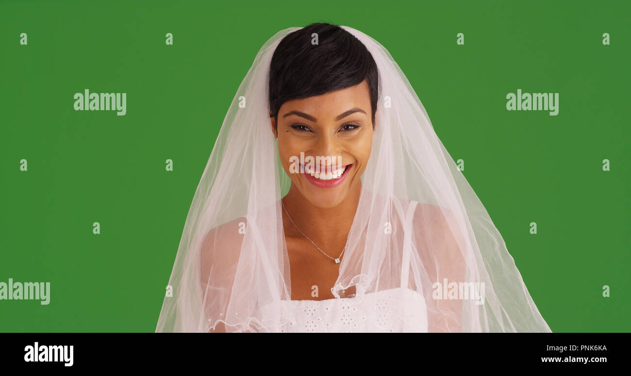 Closeup of happy bride in wedding dress smiling at camera on green screen  Stock Photo - Alamy, image size:1300x775