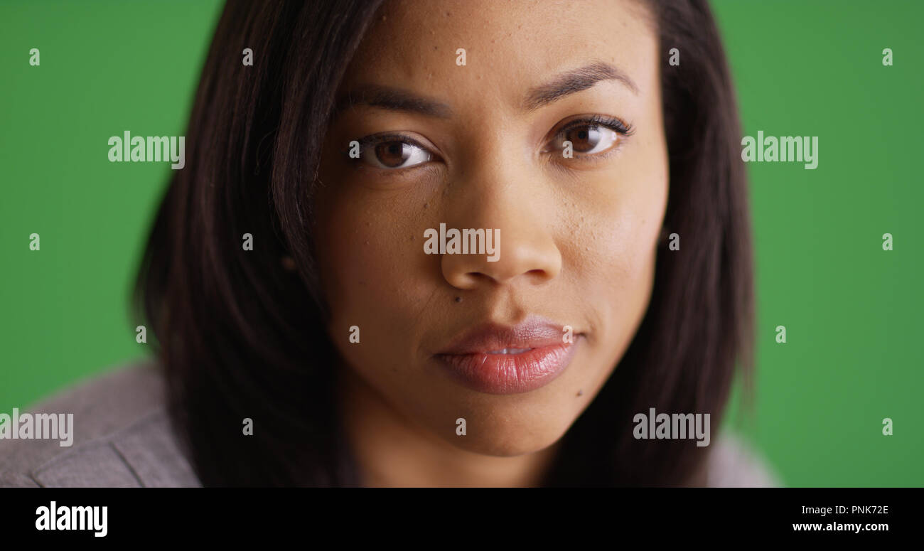 Close up of attractive African American woman looking at camera on ...
