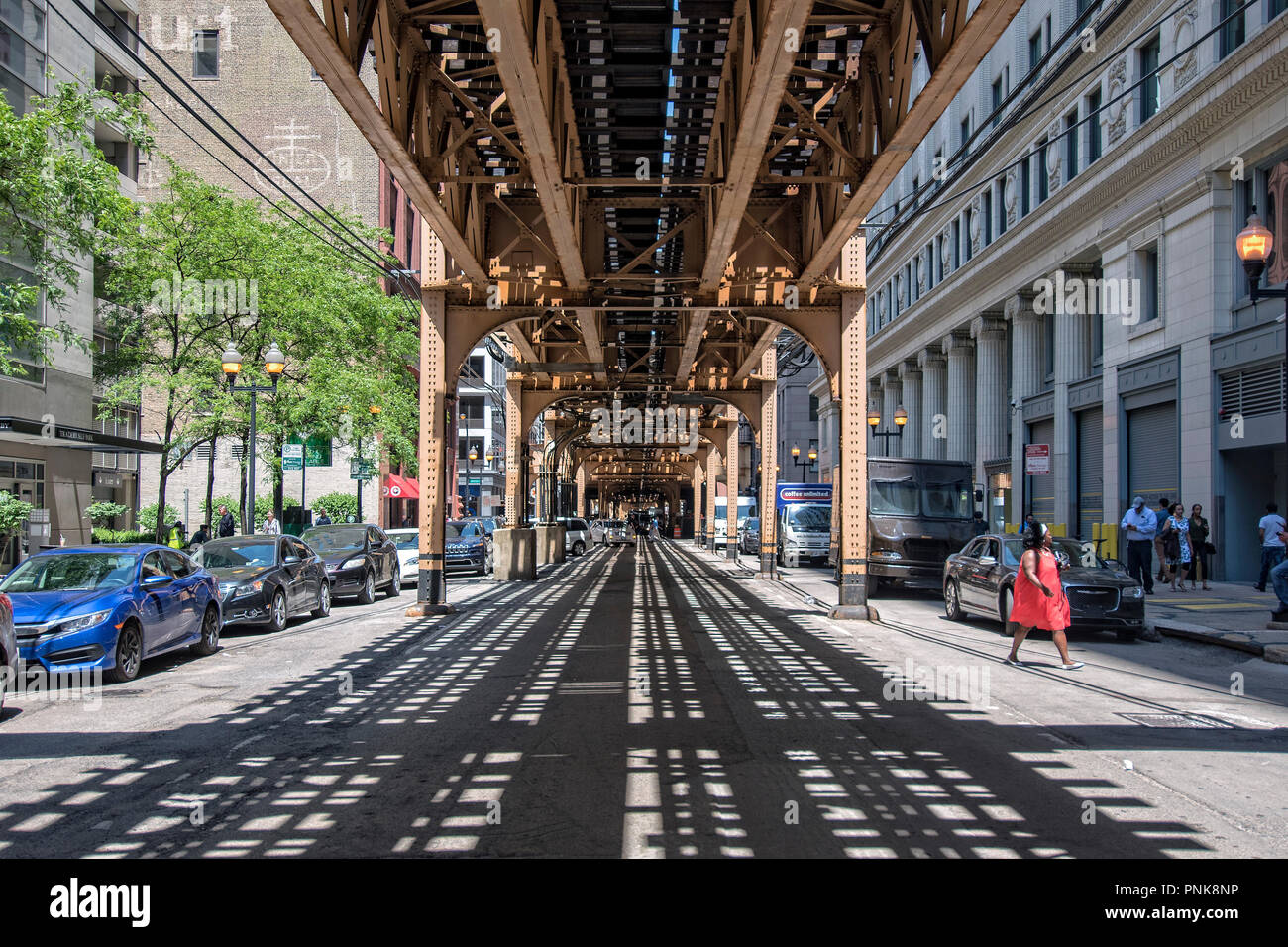 Street under the 'L' elevated train, Downtown Chicago, IL. Stock Photo