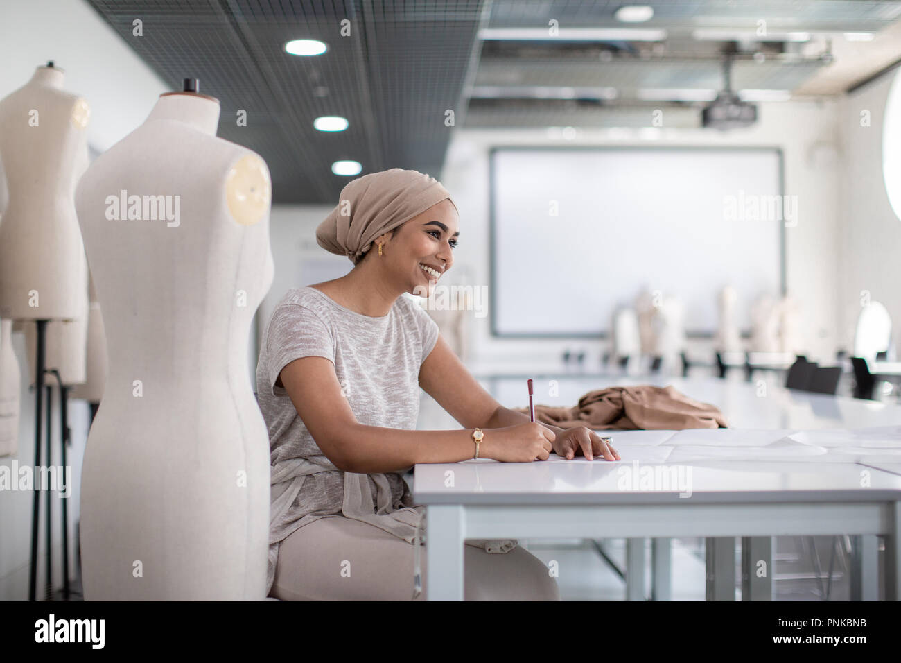 Happy muslim female student fashion designer Stock Photo